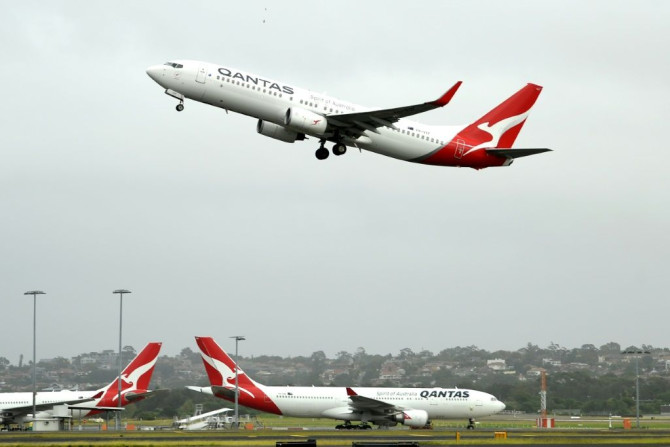Australia's competition regulator said it would block a pricing, code-sharing and scheduling deal between Qantas and Japan Airlines because it would likely mean higher fares for passengers
