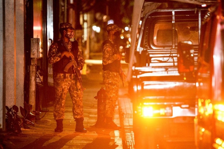 Soldiers secure a site after a bomb blast injured former Maldives president and current parliament speaker Mohamed Nasheed in Male