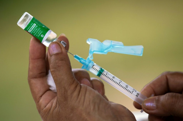 Nurse Janete Da Silva Oliveira prepares a dose of Oxford-AstraZeneca Covid-19 vaccine in the Nossa Senhora Livramento community on the banks of the Rio Negro, near Manaus, Amazonas state, Brazil February 09, 2021.