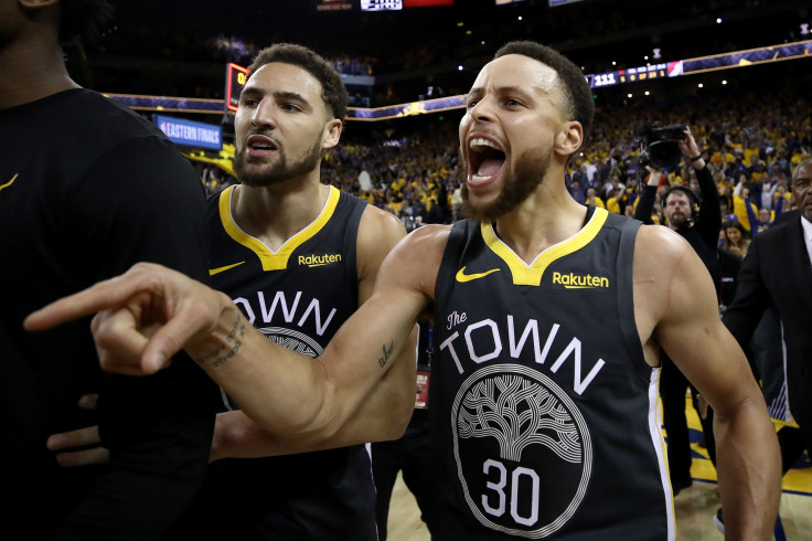 Stephen Curry #30 and Klay Thompson #11 of the Golden State Warriors celebrate after defeating the Portland Trail Blazers 114-111 in game two of the NBA Western Conference Finals at ORACLE Arena on May 16, 2019 in Oakland, California.