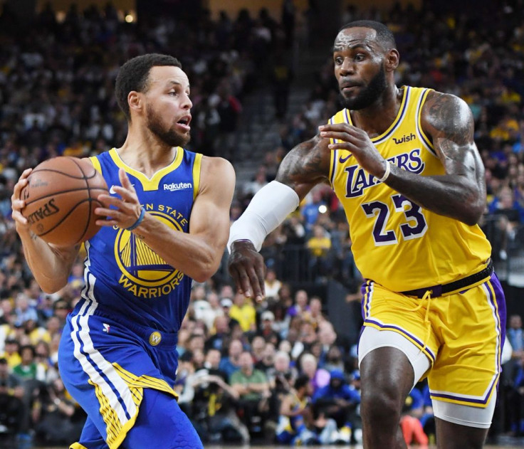 Stephen Curry #30 of the Golden State Warriors drives against LeBron James #23 of the Los Angeles Lakers during their preseason game at T-Mobile Arena on October 10, 2018 in Las Vegas, Nevada. The Lakers defeated the Warriors 123-113.
