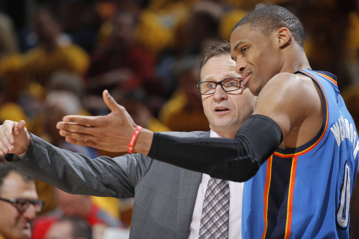 Head Coach Scott Brooks of the Oklahoma City Thunder coaches Russell Westbrook #0 against the Cleveland Cavaliers