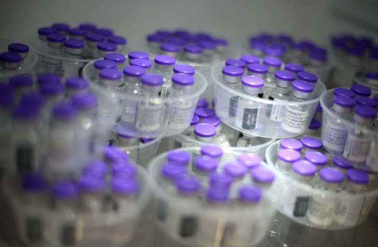This picture taken on May 13, 2021, shows vials of Comirnaty vaccine by Pfizer-BioNTech against Covid-19 in a fridge at the Baleone vaccine centre in Ajaccio on the French Mediterranean island of Corsica. - Vaccination is opened for people over 18 years o