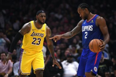 LeBron James defends Kawhi Leonard during Lakers vs. Clippers NBA 2019-20 season opener.