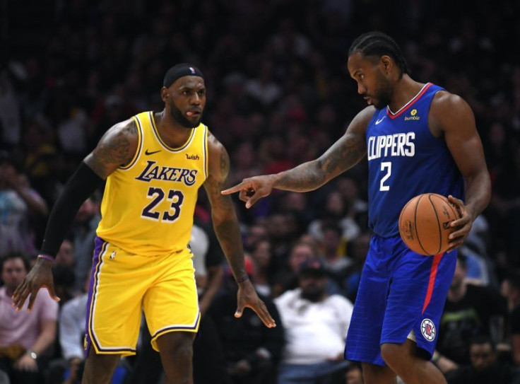 LeBron James defends Kawhi Leonard during Lakers vs. Clippers NBA 2019-20 season opener.