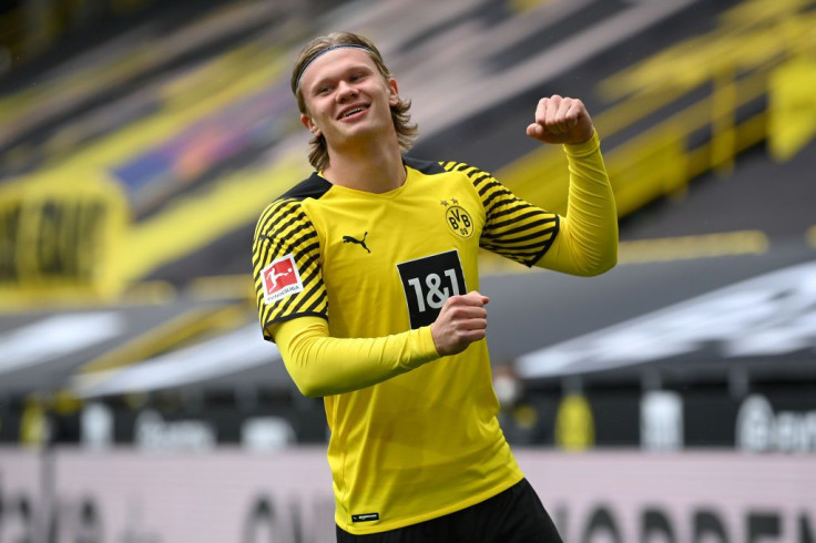 Erling Haaland of Borussia Dortmund celebrates after scoring their team's first goal during the Bundesliga match between Borussia Dortmund and Bayer 04 Leverkusen at Signal Iduna Park on May 22, 2021 in Dortmund, Germany. Sporting stadiums around Germany