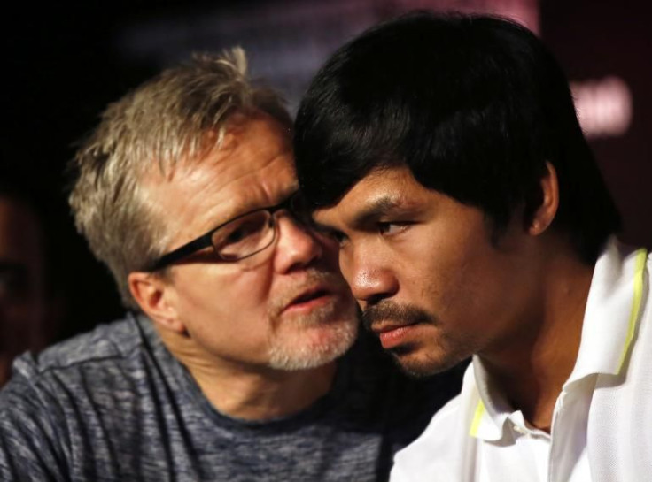 Manny Pacquiao, shown with Freddie Roach, has won his last three fights by unanimous decision.