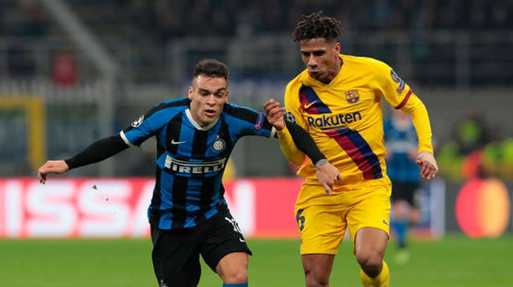 Inter Milan's Lautaro Martinez and Barcelona's Jean-Clair Todibo in action during a game at the Giuseppe Meazza Stadium on December 10, 2019.