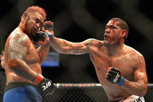 Antonio "Bigfoot" Silva lands a punch on Mark Hunt during their heavyweight bout at UFC 193.