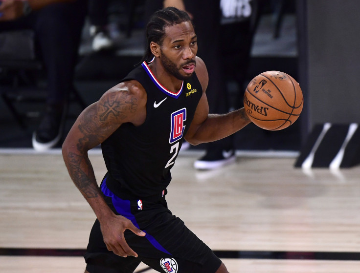 Kawhi Leonard #2 of the LA Clippers of the LA Clippers dribbles the ball during the third quarter against the Denver Nuggets in Game Seven of the Western Conference Second Round during the 2020 NBA Playoffs at AdventHealth Arena at the ESPN Wide World Of 