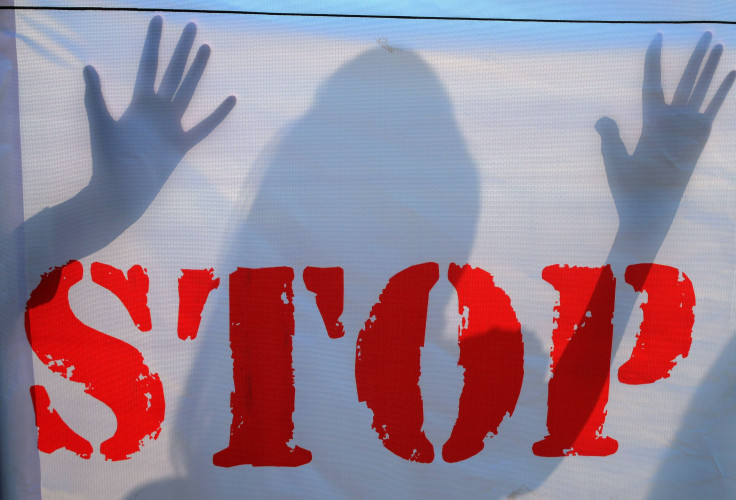 A video showing a minor girl being molested by eight men in the outskirts of Jehanabad in Bihar, India, went viral on social media. In this photo, an Indian school student's shadow falls on a banner during an awareness Campaign against Child Sex Abuse (CS