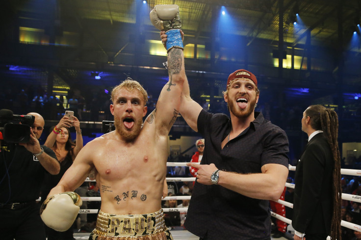 Jake Paul celebrates with his brother, Logan, after defeating AnEsonGib