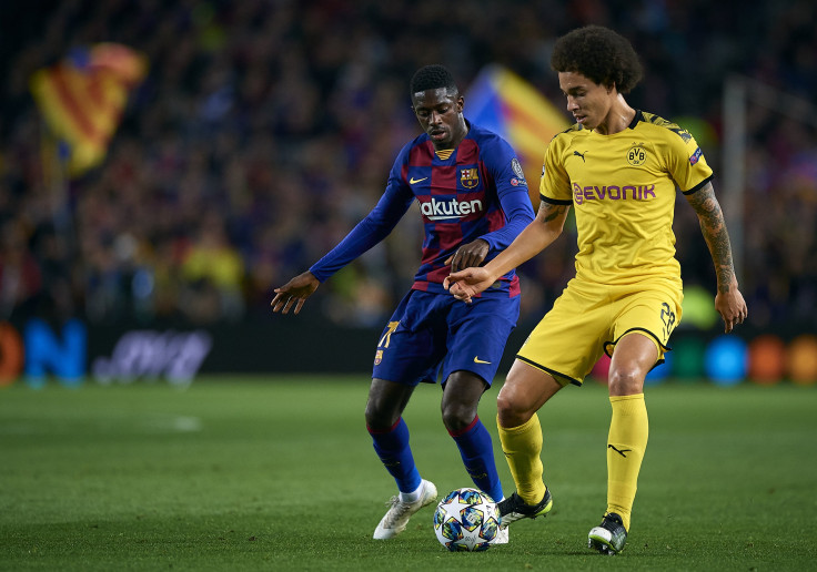 Ousmane Dembele (L) of Barcelona competes for the ball with Axel Witsel of Borussia Dortmund