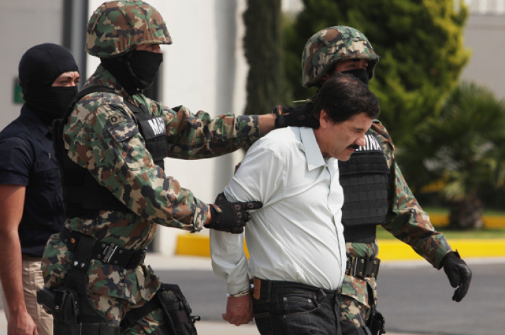 Joaquin 'El Chapo' Guzman is escorted to a helicopter in handcuffs by Mexican navy marines at a navy hanger. Guzman leader of Mexico's Sinaloa drug Cartel, was captured alive overnight in the beach resort town of Mazatlan, considered the Mexican most-want