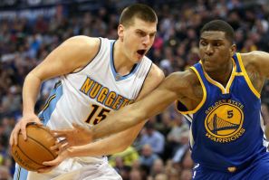 Nikola Jokic #15 of the Denver Nuggets drives to the basket against Kevon Looney #5 of the Golden State Warriors at the Pepsi Center on February 13, 2017 in Denver, Colorado.