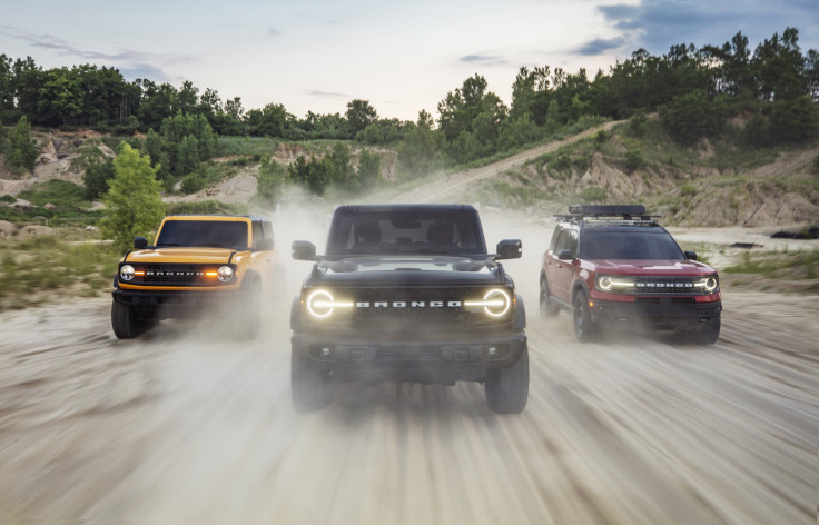 Pre-production versions of the all-new 2021 Bronco family of all-4x4 rugged SUVs, shown here, include (left) Bronco two-door in Cyber Orange Metallic Tri-Coat, Bronco four-door in Shadow Black and Bronco Sport in Rapid Red Metallic Tinted Clearcoat.