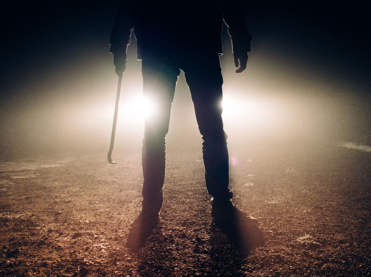 Representation. A man with a crowbar.