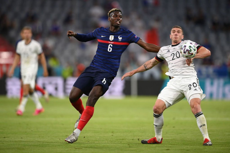 MUNICH, GERMANY - JUNE 15: Paul Pogba of France battles for possession with Robin Gosens of Germany during the UEFA Euro 2020 Championship Group F match between France and Germany at Football Arena Munich on June 15, 2021 in Munich, Germany.