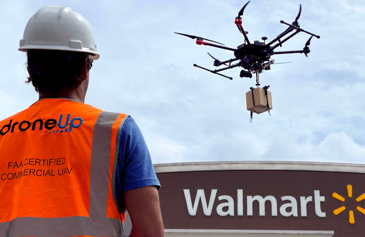 Drone delivering box above Walmart store