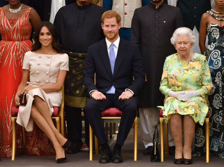 LONDON, ENGLAND - JUNE 26: Meghan, Duchess of Sussex, Prince Harry, Duke of Sussex and Queen Elizabeth II at the Queen's Young Leaders Awards Ceremony at Buckingham Palace on June 26, 2018 in London, England.