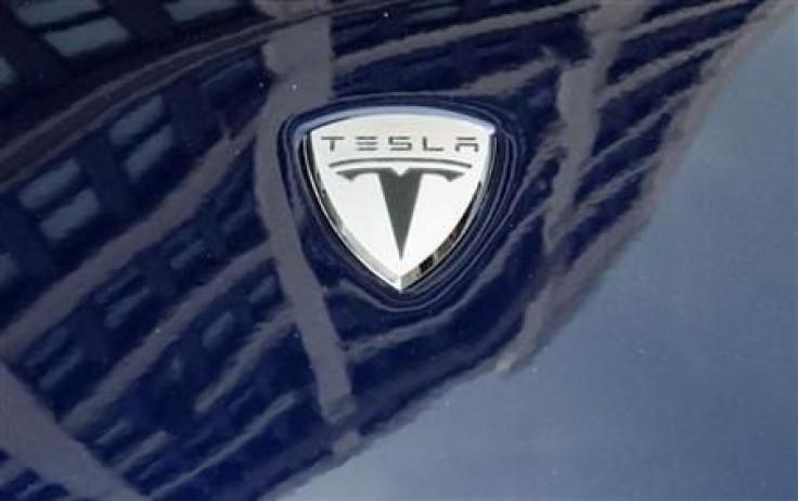 A logo of Tesla Motors on an electric car model is seen outside a showroom in New York June 28, 2010. 