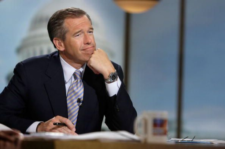 Moderator Brian Williams watches a video which pays tribute to late moderator Tim Russert during a taping of 'Meet the Press' at the NBC studios June 22, 2008, in Washington, D.C.