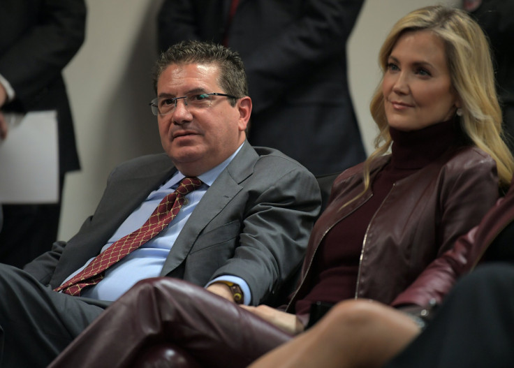 Washington Redskins owner Dan Snyder, left, sits with his wife Tanya Snyder sin the audience as Ron Rivera is introduced as the Washington Redskins new had coach at a Redskins Park press conference in Ashburn, VA on January 2, 2020 .