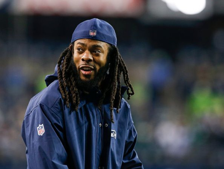Richard Sherman signed with the San Francisco 49ers after a long and successful career with the Seattle Seahawks. Pictured: Injured cornerback Richard Sherman of the Seattle Seahawks smiles from the sidelines before the game against the Philadelphia Eagle