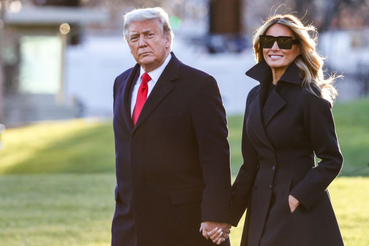 WASHINGTON, DC - DECEMBER 23: President Donald Trump and first lady Melania Trump walk on the south lawn of the White House on December 23, 2020 in Washington, DC. The Trumps are headed to Mar-a-Lago for the holidays with a government shutdown possible on