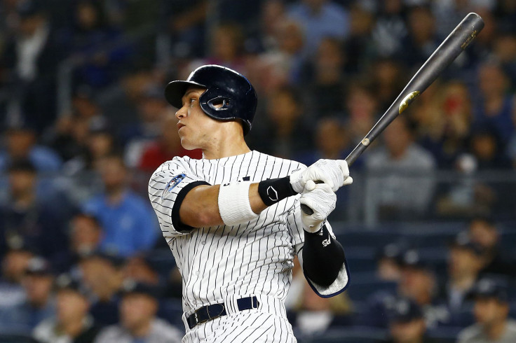 Aaron Judge #99 of the New York Yankees lines out to right field against the Boston Red Sox during the first inning in Game Three of the American League Division Series at Yankee Stadium on October 08, 2018 in the Bronx borough of New York City.