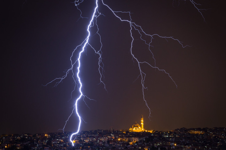 A bolt of lightning almost hit a science teacher in North Carolina as he recorded the storm passing over his home. A lightning strike is pictured over the Istanbul skyline during a thunderstorm on May 7, 2017 in Istanbul, Turkey.