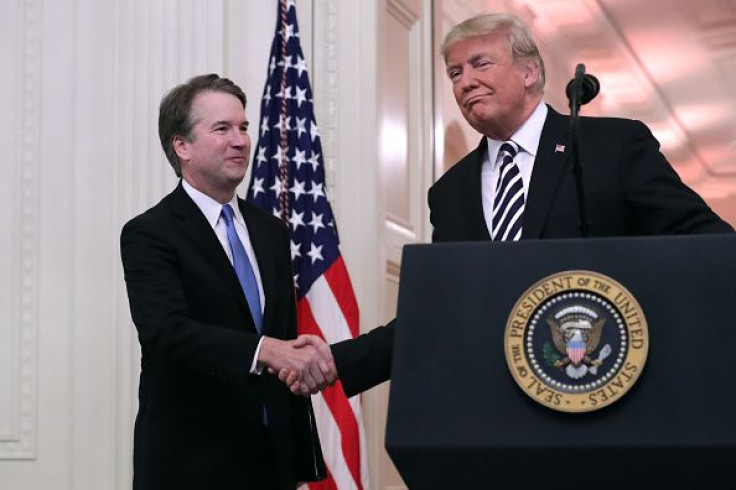 Supreme Court Justice Brett Kavanaugh (L) shakes hands with President Donald Trump during Kavanaugh's ceremonial swearing in in the East Room of the White House in Washington, D.C., Oct. 08, 2018.