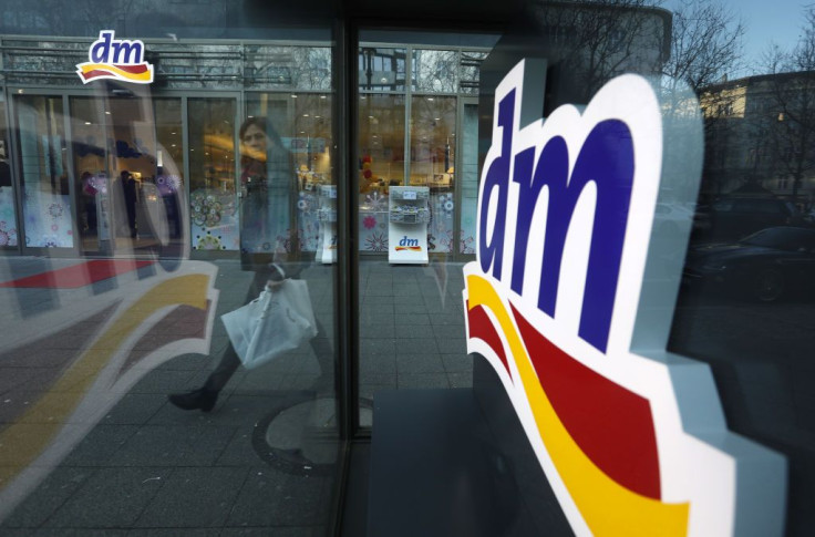 Pedestrians pass by a DM Drogerie Store on January 8, 2018 in Berlin, Germany. According to government statisticians, nominal revenue grew compared to the previous year and growing online sales have enabled German retailers to achieve record growth in 201