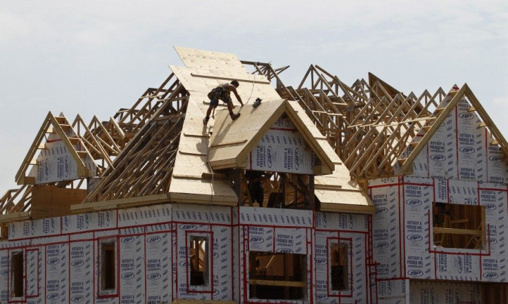 A builder works on the the roof of a new home under construction in the Montreal suburb of Brossard, August 10, 2010. Canadian housing starts fell in July for a third straight month and new home prices rose less than expected in June, further evidence tha