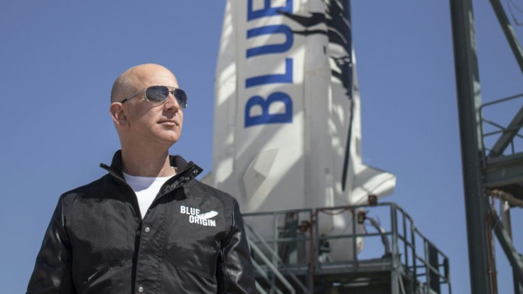 This 2015 handout photograph obtained courtesy of Blue Origin shows Jeff Bezos, founder of Blue Origin, at New Shepard's West Texas launch facility before the rocket's maiden voyageThe two companies leading the pack in the pursuit of space tourism say t