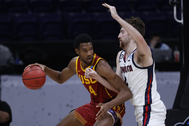 MARCH 30: Evan Mobley #4 of the USC Trojans dribbles against Drew Timme #2 of the Gonzaga Bulldogs during the first half in the Elite Eight round game of the 2021 NCAA Men's Basketball Tournament at Lucas Oil Stadium on March 30, 2021 in Indianapolis, Ind