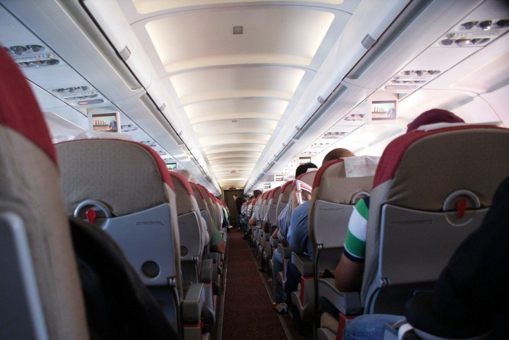 Image: A hallway inside an aircraft.