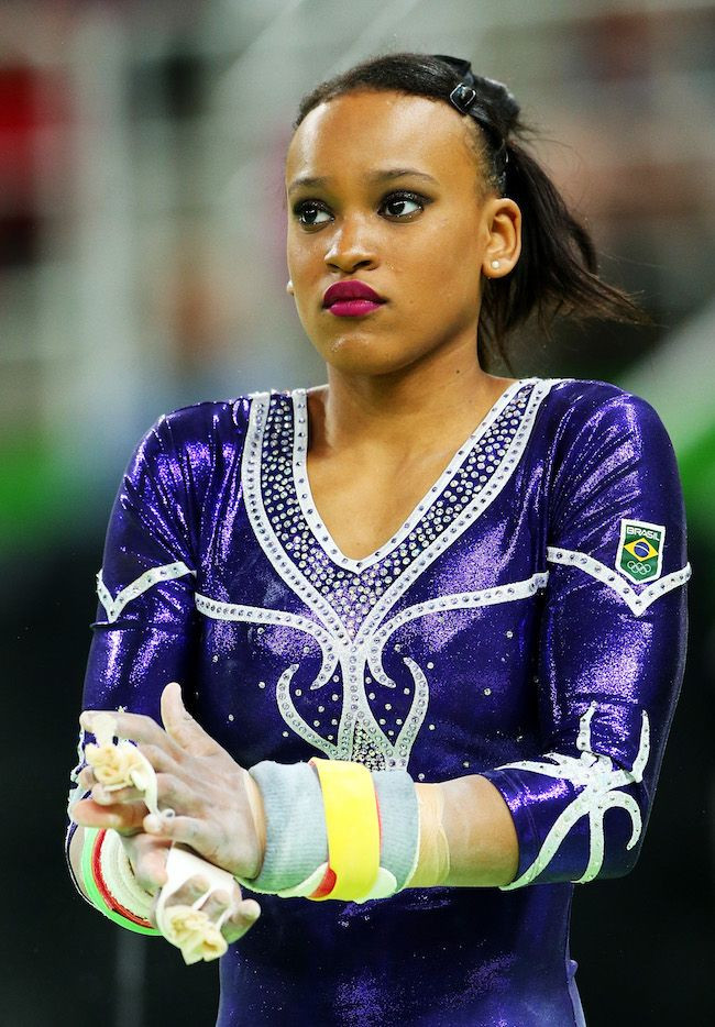 Rebecca Andrade of Brazil in Rio wearing a shiny purple leotard with white trim and crystal embellishment
