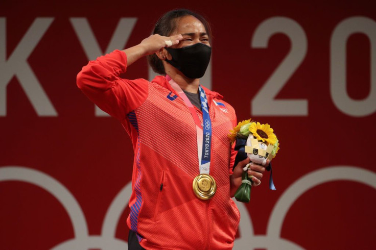 TOKYO, JAPAN - JULY 26: Gold medalist Hidilyn Diaz of Team Philippines poses with the gold medal during the medal ceremony for the Weightlifting - Women's 55kg Group A on day three of the Tokyo 2020 Olympic Games at Tokyo International Forum on July 26, 2