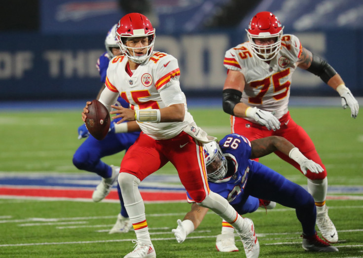 Darryl Johnson #92 of the Buffalo Bills dives to try and tackle Patrick Mahomes #15 of the Kansas City Chiefs as he looks to throw a pass during the second half at Bills Stadium on October 19, 2020 in Orchard Park, New York. 