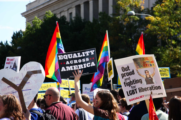 An increasing number of institutions, including schools, colleges and universities are encouraging students to embrace and be proud of whatever gender they identify with. In this photo, demonstrators wave flags and banners in Washington as tens of thousan