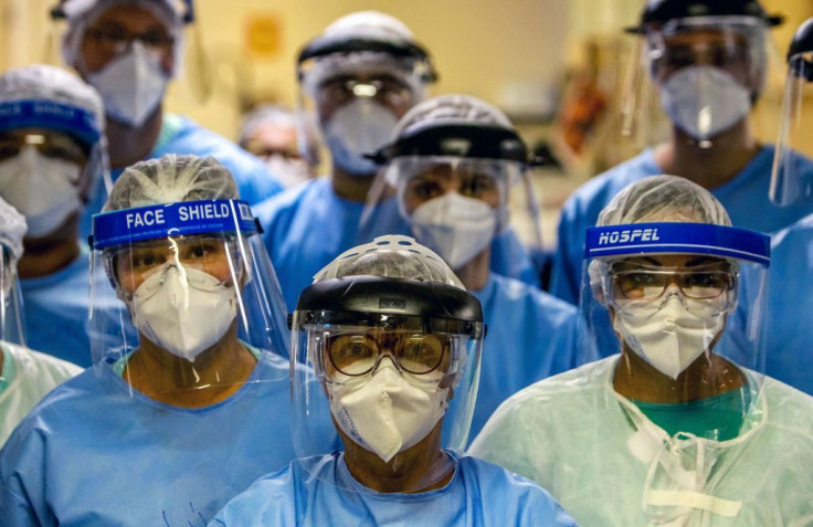 A group of doctors working with patients infected with the novel coronavirus COVID-19 wear face shields at the Intensive Care Unit of the Hospital de Clinicas in Porto Alegre, Brazil, on April 15, 2020.