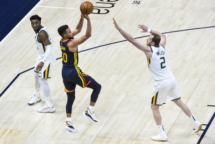 Stephen Curry #30 of the Golden State Warriors shoots over Joe Ingles #2 of the Utah Jazz during a game at Vivint Smart Home Arena on January 23, 2021 in Salt Lake City, Utah.