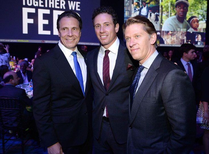 New York Governor Andrew Cuomo and Chris Cuomo attend The Robin Hood Foundation's 2015 Benefit at Jacob Javitz Center on May 12, 2015 in New York City. The report from New York AG Letitia James revealed Chris Cuomo's involvement in strategizing how Gov. A
