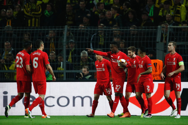 Divock Origi celebrates with teammates after putting Liverpool in front against Borussia Dortmund.