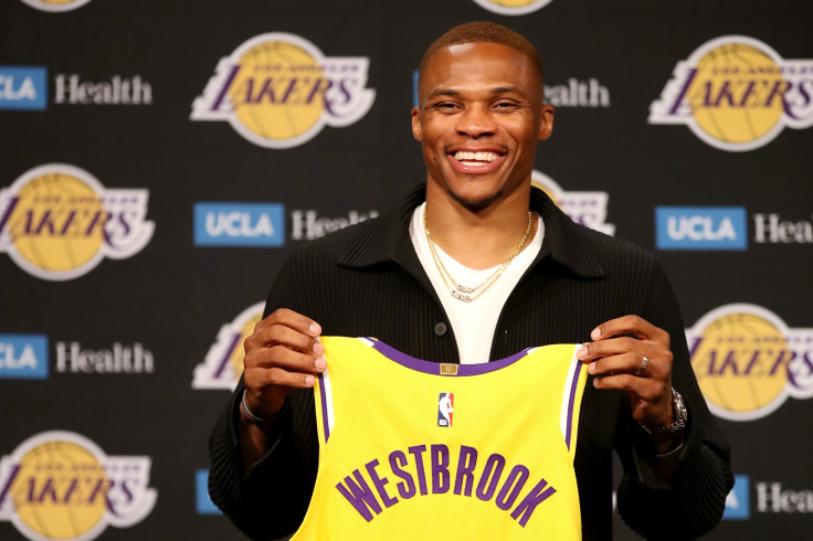 Russell Westbrook #0 of the Los Angeles Lakers poses for a picture with his jersey during a press conference at Staples Center on August 10, 2021 in Los Angeles, California.