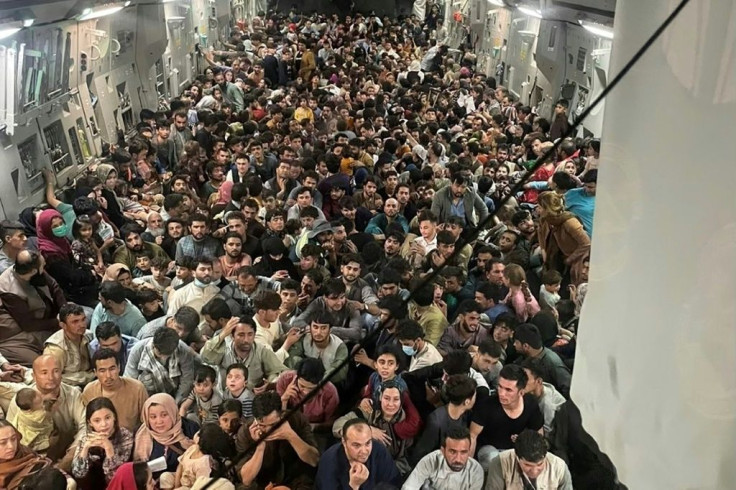 A US Air Force C-17 is seen loaded with some 640 Afghans fleeing Afghanistan after the Taliban takeover. A Democrat lawmaker slammed U.S. President Joe Biden's claim that some Afghans refused to leave the country earlier, before the Afghan government coll