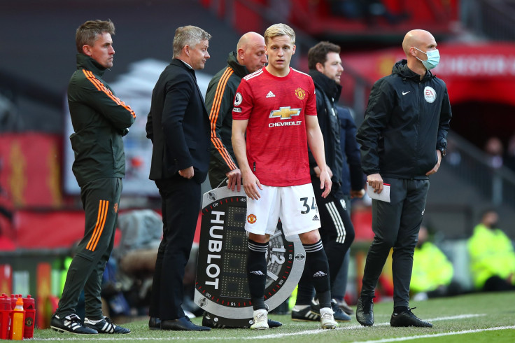 Donny van de Beek of Manchester United prepares to enter the game as a substitute during his last match during the Premier League match between Manchester United and Fulham at Old Trafford on May 18, 2021 in Manchester, United Kingdom