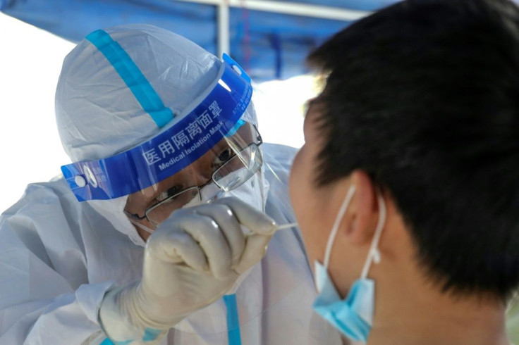 Pictured is someone getting a COVID test.