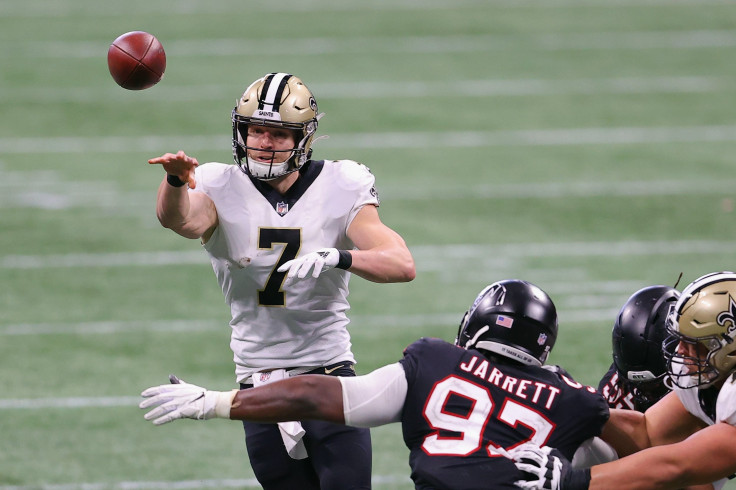 Taysom Hill #7 of the New Orleans Saints looks to make a second quarter pass against the Atlanta Falcons at Mercedes-Benz Stadium on December 06, 2020 in Atlanta, Georgia. 